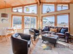 Living room offers great views and many comfortable seating choices.